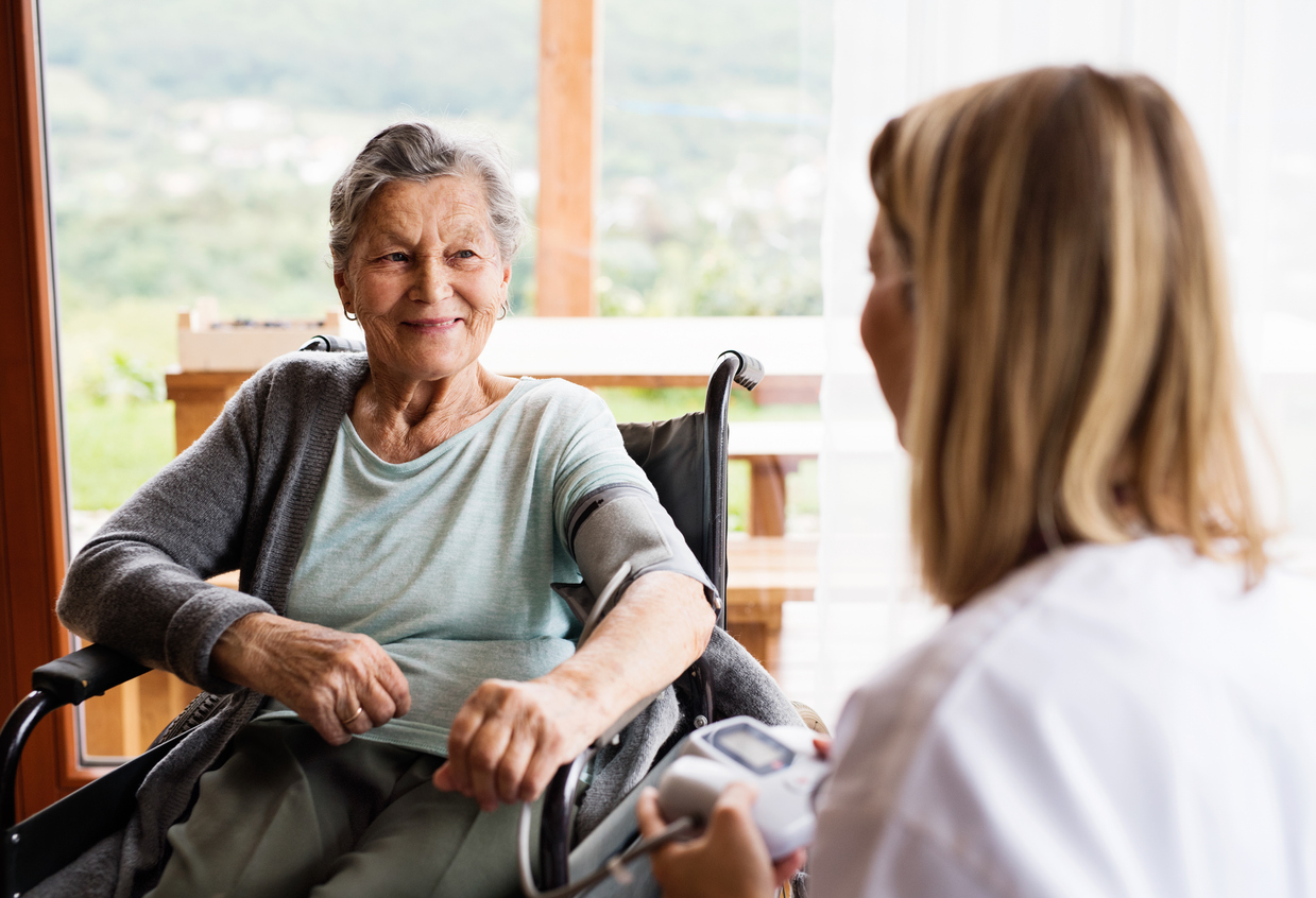 Caregiver providing compassionate care to senior resident